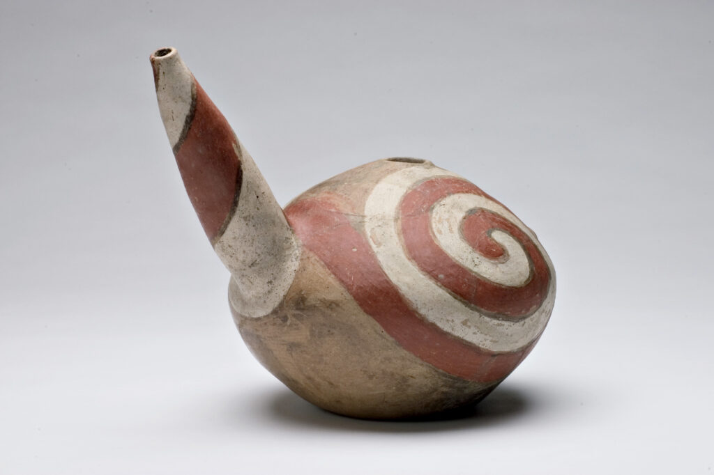 The bold interlocking swirl of red and white suggests worldly dualities. Painted ceramics such as this are synonymous with Quapaw peoples. The group migrated from the Ohio River valley south to the confluence of the Arkansas and Mississippi rivers around the 16th century. During this time, artists stopped using exotic North American materials sourced through long distance trade, such as copper and shell, and instead expanded upon earlier ceramic traditions. Quapaw artists seem to draw inspiration from the globular body and tapering necks of gourds while consistently using color combinations of red, white, black, and buff. It is likely this “teapot” form was based on vessels introduced following the arrival of Europeans in the mid-16th century. The Quapaw nation continued to inhabit what is now Arkansas through the early 19th century. Following policies set by the United States government and the signing of three treaties, the government forcibly removed Quapaw peoples to present-day Oklahoma, where the Quapaw nation is located today.